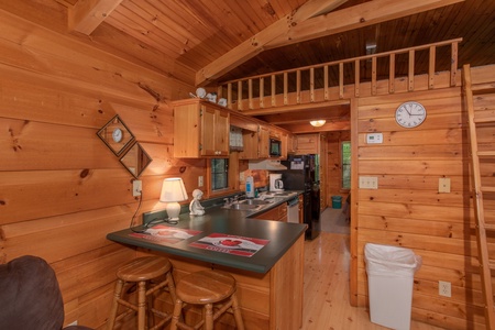 barstool seating for two and kitchen at angel's dream a 1 bedroom cabin rental located in gatlinburg