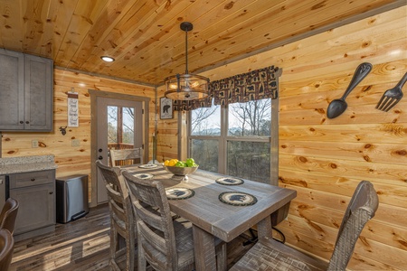 Dining table for six at Everly's Splash, a 4 bedroom cabin rental located in Pigeon Forge