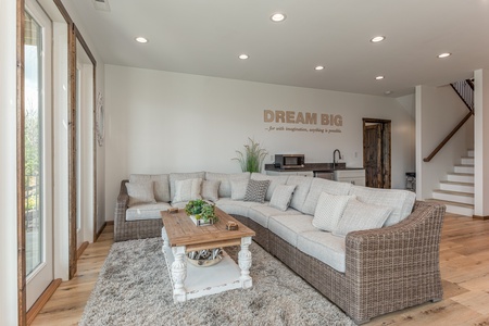 Large sectional sofa in the lower living room at Mountain Celebration, a 4 bedroom cabin rental located in Gatlinburg