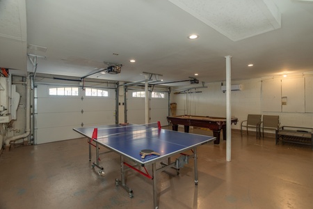 Ping pong and pool table in the game room at Best View Ever! A 5 bedroom cabin rental in Pigeon Forge