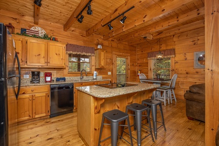 Kitchen with black appliances and granite counters at Livin' Simple, a 2 bedroom cabin rental located in Pigeon Forge