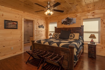Bedroom with king bed, two night stands and two lamps at Gar Bear's Hideaway, a 3 bedroom cabin rental located in Pigeon Forge