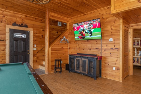 Pool Table and flat screen tv at Mountain Mama, a 3 bedroom cabin rental located in pigeon forge