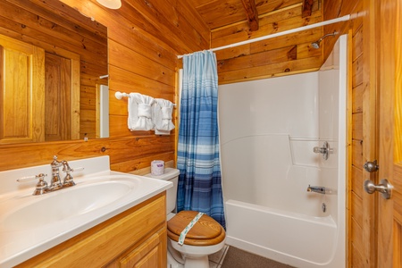 Bathroom with a tub and shower at Family Getaway, a 4 bedroom cabin rental located in Pigeon Forge