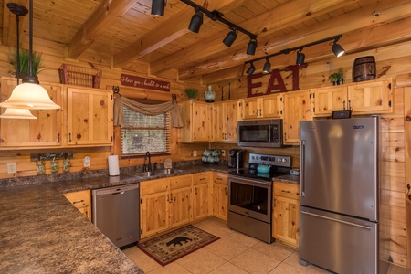 Kitchen with stainless appliances at Mountain View Meadows, a 3 bedroom cabin rental located in Pigeon Forge