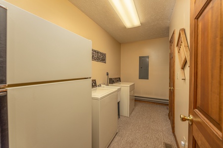 Laundry room with a fridge, washer, and dryer at Cubs' Crib, a 3 bedroom cabin rental located in Gatlinburg