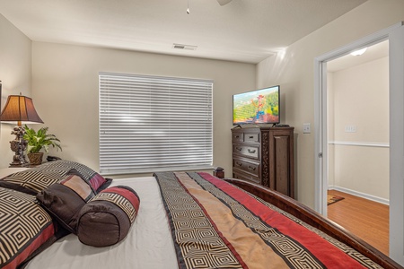 Bedroom with flat screen tv at A Pigeon Forge Retreat, a 2 bedroom cabin rental located in Pigeon Forge