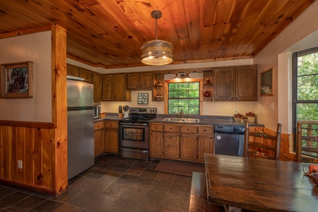 Kitchen with stainless steel appliances at Hidden Pleasure, a 1-bedroom cabin rental located in Gatlinburg