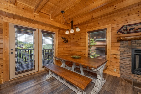 Picnic style table in dining area at Loving Every Minute, a 5 bedroom cabin rental located in Pigeon Forge