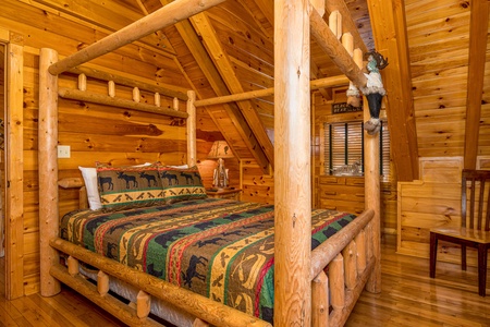 Bed with Log Furniture at Poolhouse Lodge