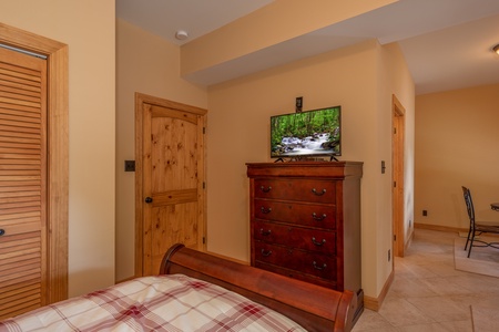 Dresser and TV in a bedroom at Mountain Lake Getaway, a 3 bedroom cabin rental located at Douglas Lake