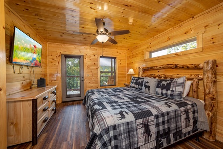 Master Bedroom with log furniture at Make A Splash, a 2 bedroom cabin rental located in gatlinburg