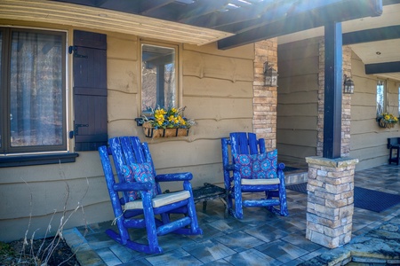 Blue rocking chairs on the patio at Best View Ever! A 5 bedroom cabin rental in Pigeon Forge