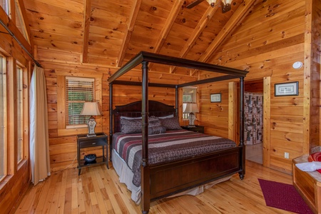 Bedroom with a king canopy bed at Majestic Sunrise, a 1 bedroom cabin rental located in Pigeon Forge