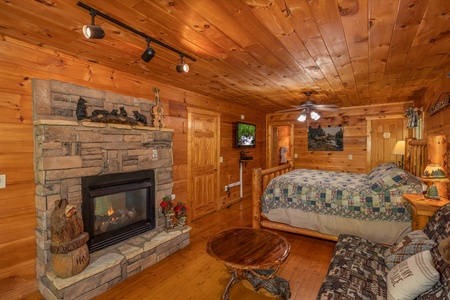 Fireplace in the king bedroom at Misty Mountain Escape, a 2 bedroom cabin rental located in Gatlinburg