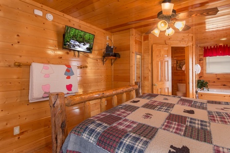 TV in a bedroom at Country Bear's Getaway, a 3-bedroom cabin rental located in Gatlinburg