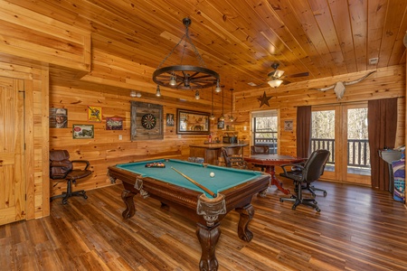Game room with pool table at God's Country, a 4 bedroom cabin rental located in Pigeon Forge