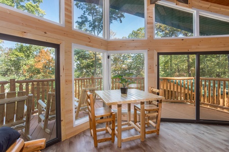 Loft table with chairs at Forever Country, a 3 bedroom cabin rental located in Pigeon Forge