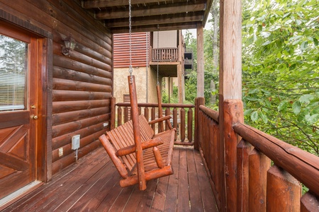 Swing on the porch at A Beautiful Memory, a 4 bedroom cabin rental located in Pigeon Forge