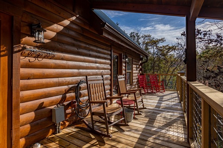 Seating for 4 on the deck at Bear Feet Retreat, a 1 bedroom cabin rental located in pigeon forge