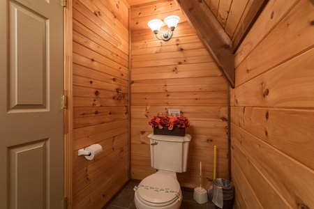 Half bath at Living on Love, a 2 bedroom cabin rental located in Pigeon Forge
