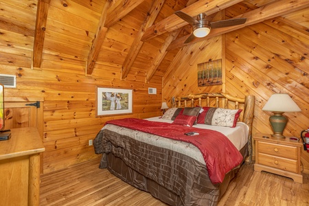 Loft bedroom with a night stand and lamp Walkin' To Gatlinburg, a 2 bedroom cabin rental located in Gatlinburg