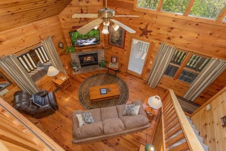 Looking down into the living room at Hillside Haven, a 1 bedroom cabin rental located in Pigeon Forge