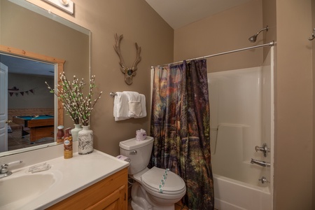 Bathroom with a tub and shower at Hawk's Heart Lodge, a 3 bedroom cabin rental located in Pigeon Forge