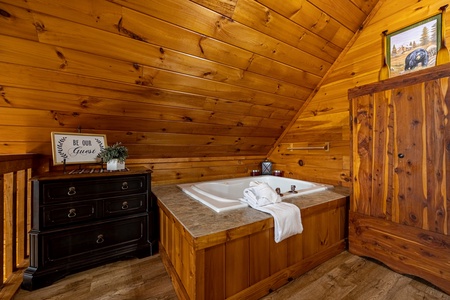 Upstairs jacuzzi at Cabin On The Hill, a 1 bedroom cabin rental located in Pigeon Forge
