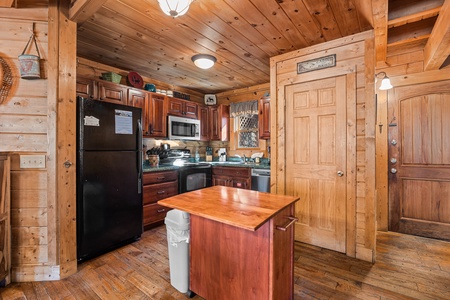 Kitchen appliances  and island at A Beary Nice Cabin, a 2 bedroom cabin rental located in Pigeon Forge