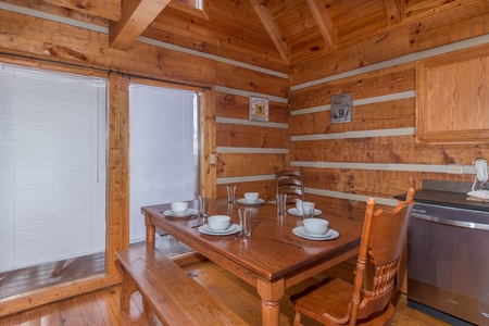 Dining space for five at Ella-Vation, a 3 bedroom cabin rental located in Gatlinburg