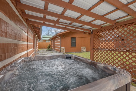 Enclosed hot tub area at Rustic Ranch, a 2 bedroom cabin rental located in Pigeon Forge