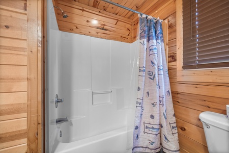 Bathroom shower/tub combo at Natural Wonder, a 4 bedroom cabin rental located in Gatlinburg