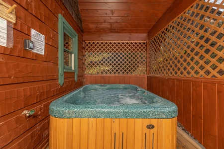 Hot tub with privacy fence A Beary Nice Cabin, a 2 bedroom cabin rental located in Pigeon Forge