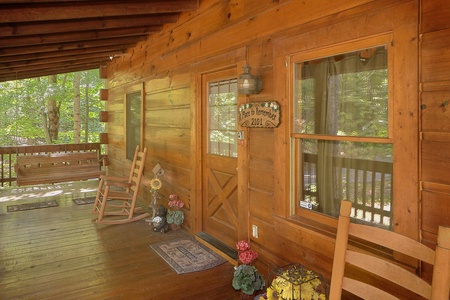 Front porch with rocking chairs at A Place to Remember, a 2 bedroom cabin rental located in Gatlinburg