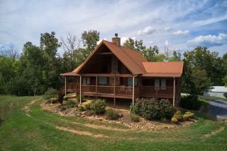 Looking at the front exterior of Cedar Creeks, a 2-bedroom cabin rental located near Douglas Lake