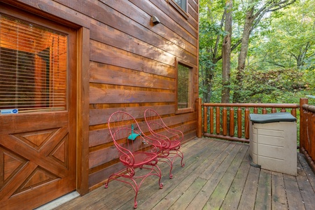 Two seats on a deck at Firefly Ridge, a 2 bedroom cabin rental located in Pigeon Forge