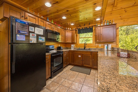 Kitchen at Moonbeams & Cabin Dreams, a 3 bedroom cabin rental located in Pigeon Forge