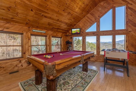 Pool table in the loft at Hatcher Mountain Retreat a 2 bedroom cabin rental located in Pigeon Forge