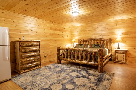 Studio Log Bed at 3 Crazy Cubs, a 5 bedroom cabin rental located in pigeon forge