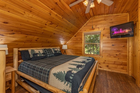 Bedroom with TV at Moonlit Pines, a 2 bedroom cabin rental located in Pigeon Forge