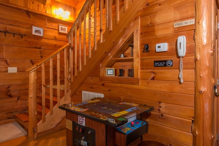 Arcade game at Hawk's Nest, a 1 bedroom cabin rental located in Pigeon Forge