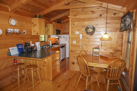 Kitchen and dining area at Seclusion, a 1 bedroom cabin rental located in Gatlinburg