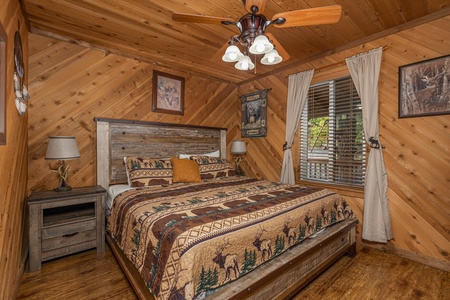 Bedroom with a king bed, two night stands, and two lamps at Bearing Views, a 3 bedroom cabin rental located in Pigeon Forge