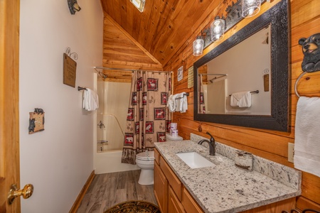 Bathroom with a tub and shower at Southern Charm, a 2 bedroom cabin rental located in Pigeon Forge