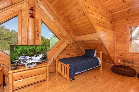 Large TV in the bunk room at Great View Lodge, a 5-bedroom cabin rental located in Pigeon Forge