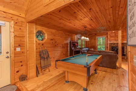 Green felt pool table at Lazy Mountain Retreat, a 1 bedroom cabin rental located in Gatlinburg
