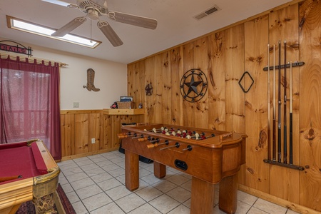 Foosball table in the game room at Almost Bearadise, a 4 bedroom cabin rental located in Pigeon Forge
