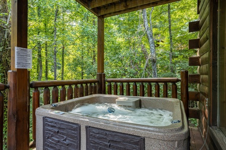 Hot tub on the deck at A Bear on the Ridge, a 2 bedroom cabin rental located in Pigeon Forge