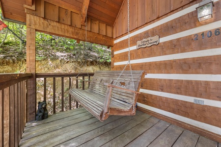 Swing on deck at Bearfoot Crossing, a 1-bedroom cabin rental located in Pigeon Forge